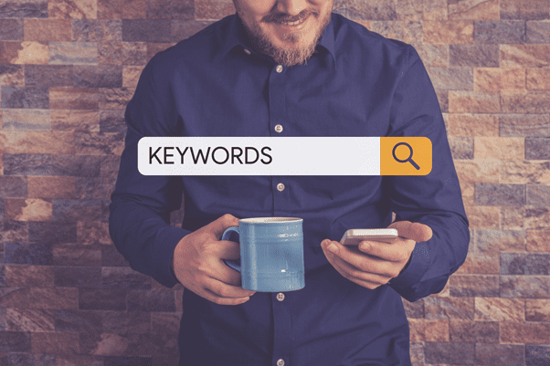 Man looking up the meaning of keywords on mobile